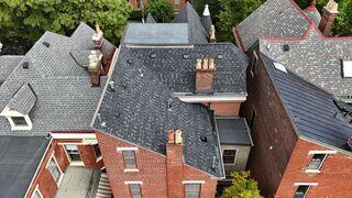 This is what the roof looked like after we finished the project. The Granite Black shade and the London Brown edge/trim color matches perfectly. This roof is protected against any installation errors that could lead to leaks for the next 50 years, in addition to all manufacturer warranties.