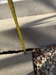 A close-up of the gap that has formed at the step