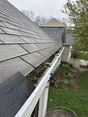 This photo shows the gutters clogged with debris. This photo was also taken upon the initial inspection.