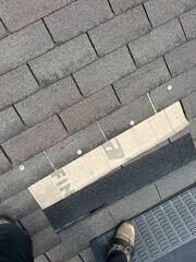 This photo shows a section of missing shingles that blew off from a storm. Our Inspector tarped the section while the insurance company sent us their closest matching shingle to see if a patch repair could be feasible. This photo was also taken upon the initial inspection.