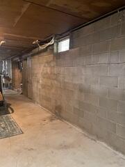 Before: Our Design Specialist, Chuck, recommended installing GeoLock Wall Anchors along the struggling wall.