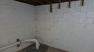 Before: Our Design Specialist, Derek, recommended installing PowerBraces along the damaged walls.
