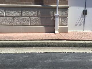 This photo shows what the sidewalk looked like after we leveled out. This sidewalk is now safe to walk on.