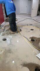 Before installing the slab piers, the homeowners cleared the paneled flooring and moved out some furniture to give our team full access. For this project, we drilled 43 precision holes, strategically placed to provide consistent support across the entire slab and ensure a stable, level floor once the piers were in place.
