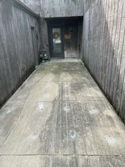 During: Our Foreman, Patrick, and his crew inserted PolyLevel below the sinking concrete slabs.