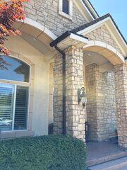 Seamless Brown Gutters Elevate Draper Home's Entryway