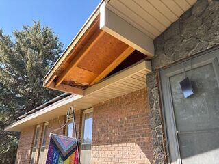 lots of work was done to remove the soffit so the Gutter Shutter would fit in seamlessly with the soffit
