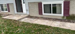 During: Our Foreman, Patrick, and his crew lifted the sunken slabs and walkway in front of the home.