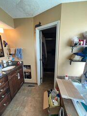 To access the plumbing and fix the leak, a big hole was cut in the wall.