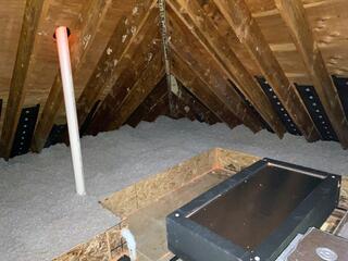 After completing the attic air sealing and insulation, we installed the David Lewis Hatch Cover over the entrance to provide extra insulation and a tighter seal.