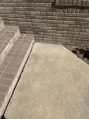 Before: Our Design Specialist, Ian, conducted a detailed inspection and confirmed that the sidewalk required repair.