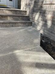 During: Our Foreman, Charlie, and his crew successfully lifted and leveled the sidewalk back to its original position.