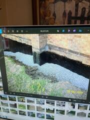 The homeowner showed our inspector photos of the exterior waterproofing installation back in 2015. Since then, this section of the home had been excavated three times for repairs, including re-sealing the wall and drainage replacing.