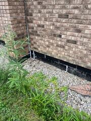 The exterior drainage tile was installed deep down below this gravel bed. Exterior drains are prone to clogging, which is common in many homes. Over time, the black tar also deteriorated, wearing down every few years.