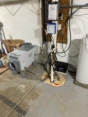After: Sam secured an Aprilaire in the basement near the TripleSafe Sump Pump.