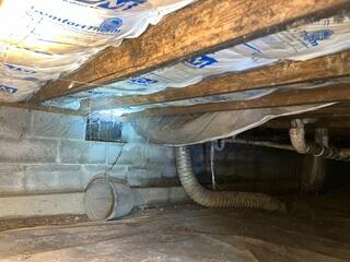 This photo shows what our inspector saw when looking at the floor joists in the crawl space. They were in the late stages of moisture damage, and were holding on for dear life.