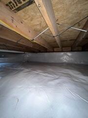 To permanently stop moisture from entering the space from the earth, our crew encapsulated the entire crawl space with our heavy-duty CleanSpace Vapor Barrier System. This durable, bright white liner completely isolates the home from the ground, blocking soil moisture and humidity from permeating the area.