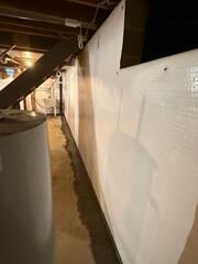 Now that the WaterGuard system is fully installed and sealed, this basement is protected from future leaks, directing water safely to the sump pump for efficient removal. Installing CleanSpace along basement walls creates a dry, protected environment for the home.