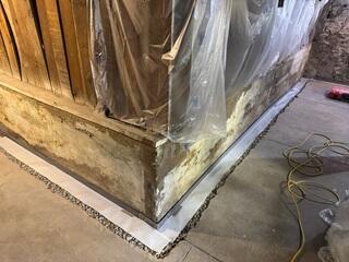 WaterGuard channel backfilled with gravel and sealed with moisture-transfer prevention tape for long-term performance.