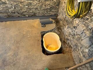 TripleSafe sump basin set into place before connection, ready to handle incoming water from the new drainage system. This sump basin is the largest we offer.