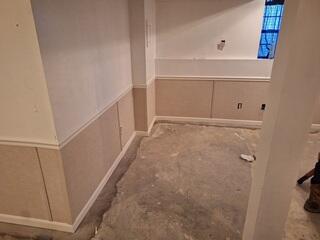 Each EverLast panel includes a built-in vapor barrier backing that helps block moisture and humidity from passing through the wall surface. The bottom edge of the panels is tucked neatly into the WaterGuard wall flange, creating a continuous, sealed system that prevents vapor transfer while maintaining a clean, finished look.