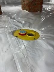 CleanSpace® Crawl Space Encapsulation System: A durable, 20-mil vapor barrier was laid across the crawl space floor and walls, sealing out ground moisture and creating a bright, clean surface. The CleanSpace system directs any water seepage toward the drainage system, preventing humidity and mold growth.

SmartDrain® Drainage System: Designed for encapsulated crawl spaces, the SmartDrain was installed beneath the CleanSpace liner to capture any unexpected plumbing leaks or seepage. The system features a WaterWatch® alarm that alerts the homeowner if water is detected.