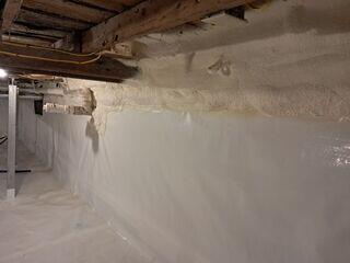 CleanSpace® Encapsulation System: A durable, 20-mil reinforced vapor barrier was installed across the entire floor and walls, sealing out ground moisture and humidity. The bright white liner instantly improved the space's appearance and usability.

Closed-Cell Spray Foam Insulation: Applied to crawl space walls, the foam provides insulation and an additional moisture barrier, helping regulate temperature and reduce energy loss.