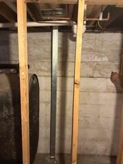 PowerBrace™ Beams: Heavy-duty, zinc-plated steel I-beams were custom-cut to fit the full height of the basement walls. Each beam was anchored securely to the concrete floor and attached to the floor joists at the top using a unique tightening bracket. This setup allows the system to be adjusted over time, gradually helping to straighten the wall back toward its original position.

Tightening Assembly: The adjustable top bracket was installed along each beam, enabling controlled torque adjustments during follow-up visits. This feature provides both immediate stabilization and the potential for long-term wall improvement.

Corrosion Protection: All PowerBrace components were zinc-coated for superior rust resistance, ensuring a clean, finished look and decades of durability even in high-humidity environments.