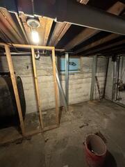 PowerBrace™ Beams: Heavy-duty, zinc-plated steel I-beams were custom-cut to fit the full height of the basement walls. Each beam was anchored securely to the concrete floor and attached to the floor joists at the top using a unique tightening bracket. This setup allows the system to be adjusted over time, gradually helping to straighten the wall back toward its original position.

Tightening Assembly: The adjustable top bracket was installed along each beam, enabling controlled torque adjustments during follow-up visits. This feature provides both immediate stabilization and the potential for long-term wall improvement.

Corrosion Protection: All PowerBrace components were zinc-coated for superior rust resistance, ensuring a clean, finished look and decades of durability even in high-humidity environments.