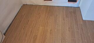 ThermalDry® Elite Plank Flooring System: Once the basement was fully waterproofed, the team installed Basement Systems' exclusive Elite Plank flooring - a durable, waterproof, and attractive wood-look plank designed specifically for finished basements. Unlike traditional flooring, it will never warp, buckle, or support mold growth, even in high humidity.