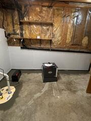 WaterGuard® Interior Drainage System: Installed along the entire perimeter of the basement floor, WaterGuard collects groundwater and wall seepage, channeling it safely to the sump pump without clogging or disrupting the floor.

TripleSafe® Sump Pump System: The heart of the waterproofing system, TripleSafe provides three levels of pumping protection - including a battery backup for power outages - ensuring the basement stays dry under all conditions.

CleanSpace® Wall System: A bright, durable vapor barrier was applied to the foundation walls. It prevents moisture from evaporating into the space and directs any wall seepage down into the WaterGuard system.

SaniDry™ Sedona Dehumidifier: Installed to control humidity, the SaniDry Sedona keeps the basement's air clean, dry, and comfortable while preventing musty odors and mold growth.