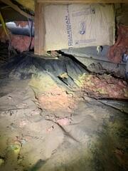 This crawl space had been humid for a long period of time, causing the fiberglass insulation to become damp and heavy and fall on the floor making it lose all insulation value and giving the rodents a great nesting material.