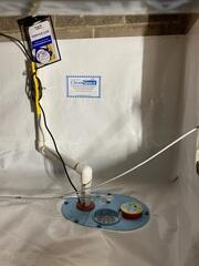 Next, our SmartSump Crawl Space Sump Pump was added to efficiently remove any water intrusion, protecting the space from flooding and long-term water damage.