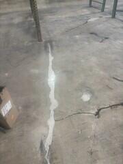 Epoxy grout at large cracks and spalled area.