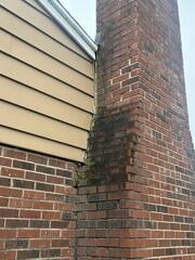 This photo shows the tilting chimney that the homeowner was concerned with.