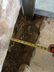 Our Foreman snapped this photo after they had straightened the wall back out. In this case, our team not only had to straighten the wall but also push it back toward its footing-a far more complex process than standard wall correction. Typically, we're working to realign a bowed wall, but when a wall has also sheared, it must be pushed horizontally as well as vertically adjusted. Every movement has to be slow, measured, and precise to keep the structure stable. That combination made this repair especially challenging and a true testament to the crew's skill and control, even though it was just a few inches.