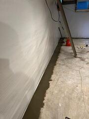 Installed basement waterproofing system