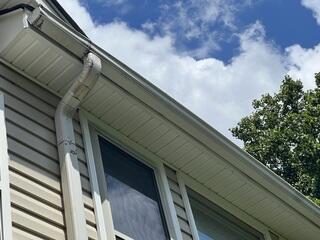 Rusted gutters and one of the worst spots for water overflow. These 5-inch gutters are not performing and are allowing rain to overflow and pool around the foundation.