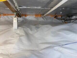 The crawl space is now fully encapsulated with our CleanSpace vapor barrier and supported by our SmartJack stabilizing system.