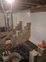 WaterGuard® Interior Drainage System
A perimeter WaterGuard drain was installed along the interior wall-floor joint to collect water leaking in at the base of the walls and beneath the slab. This system quietly and efficiently directs water to the new sump pump, keeping it out of sight along the basement perimeter.
TripleSafe® Sump Pump System
The old, inefficient sump pit was replaced with a TripleSafe sump pump system. Featuring a primary pump, a backup pump, and a battery-powered backup, TripleSafe provides multiple layers of protection-keeping the basement dry even during power outages or extreme weather events.
CleanSpace® Wall System
The crew installed the CleanSpace wall system along the affected basement walls. This bright, durable vapor barrier not only helps control moisture and humidity coming through the walls, but also directs any wall seepage down into the WaterGuard system. It immediately improved the basement's appearance and set the stage for future finishing.