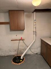 The PVC pipe was installed in the sump pump system and is connected to the fan