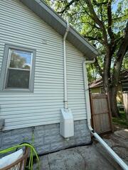 The fan installed at the exterior of the home to expel the radon gas