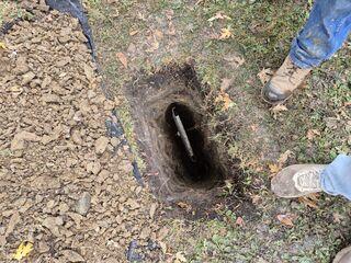 Our crew placing the earth anchor
