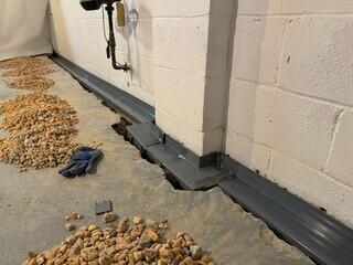 WaterGuard is set neatly along the perimeter before being connected to the new SuperSump pump system.