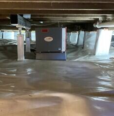 The crawl space is now fully encapsulated with our CleanSpace vapor barrier and the SaniDry Sedona dehumidifier keeps humidity low.