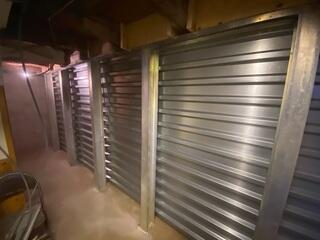 This image captures the finished EverBrace™ installation, with full-height steel panels and support beams covering the previously failing wall. The system now provides a clean, rigid, and permanent solution to severe wall deterioration.