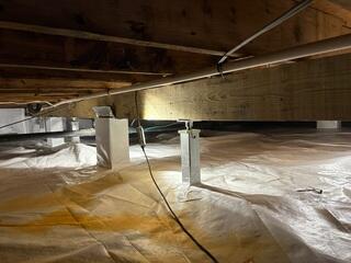 SmartJacks were installed and adjusted to the height of the crawl space to move any sagging beams back to their original position and keeping it tight and secure.