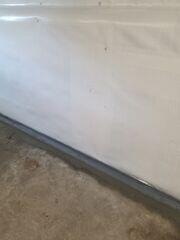 WaterGuard was installed around the perimeter of the basement to direct any seeping water from the walls to the sump pumps for removal.