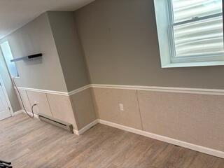 Our EverLast Wall Panels were added to replace water-damaged materials with a durable, mold-resistant, and long-lasting finish that brightens the basement while standing up to future moisture.