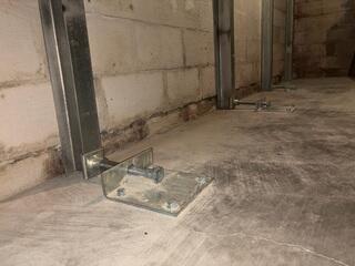 This photo shows the same angle as the last photo, after we pushed and straightened the wall back out.